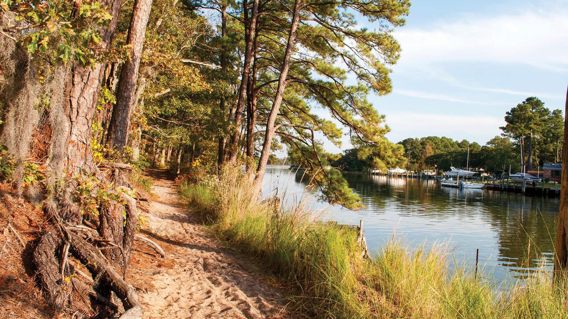A photo of a trail in a state park on the water