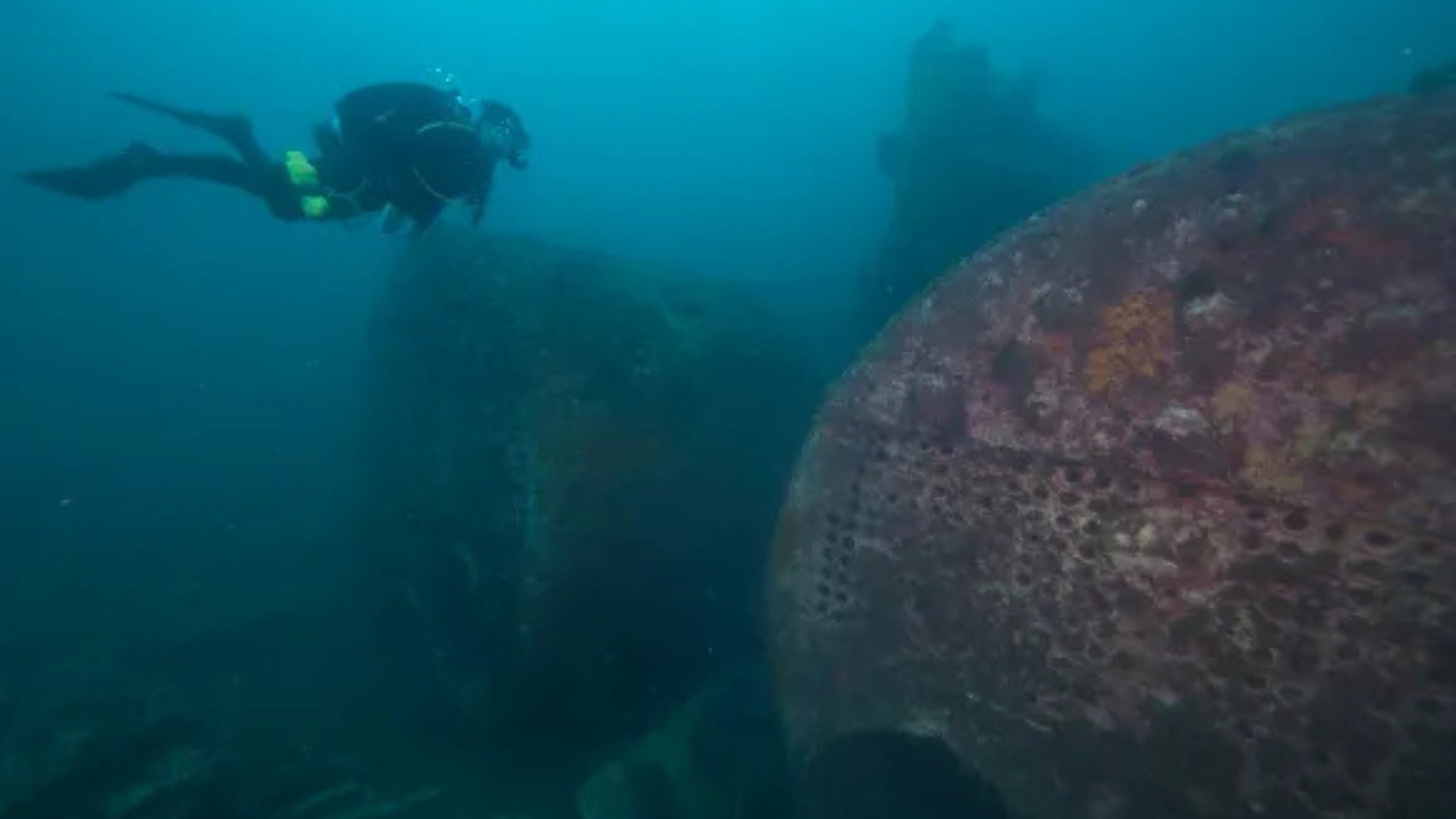 Photo of scuba diver by boilers of the Caribsea.