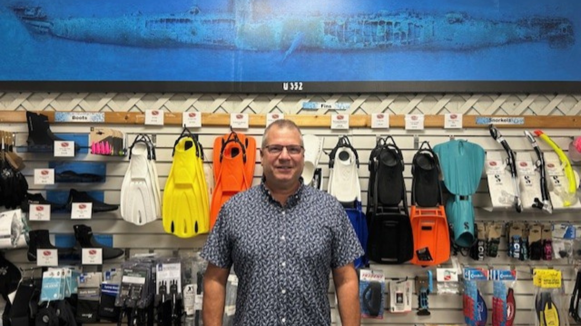 Photo of Larry Kuebler in the Olympus Dive Center.