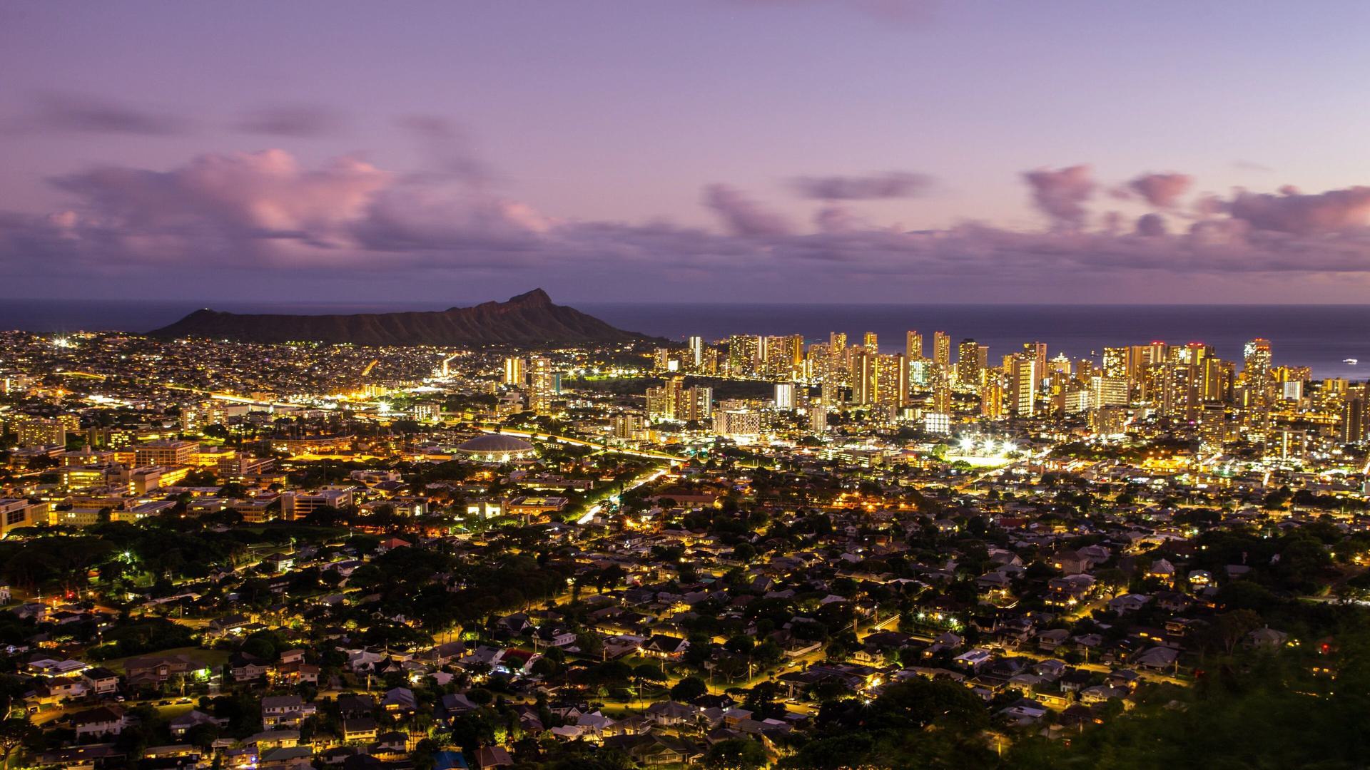 an aerial view of a city at night with a lot of lights