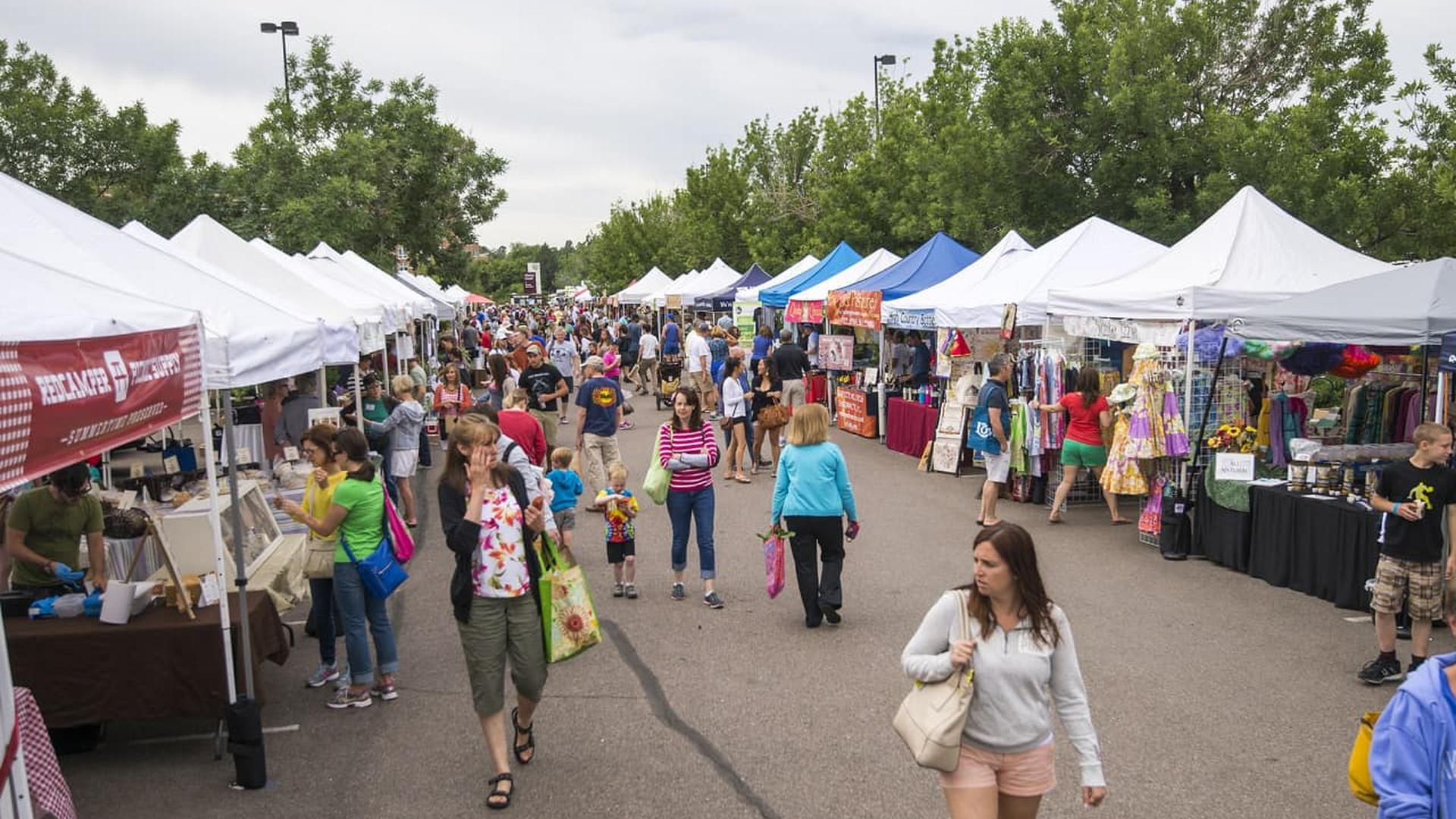 people walking at a farmers market