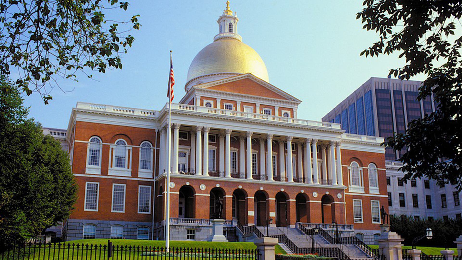 a front of the building with a flag outside