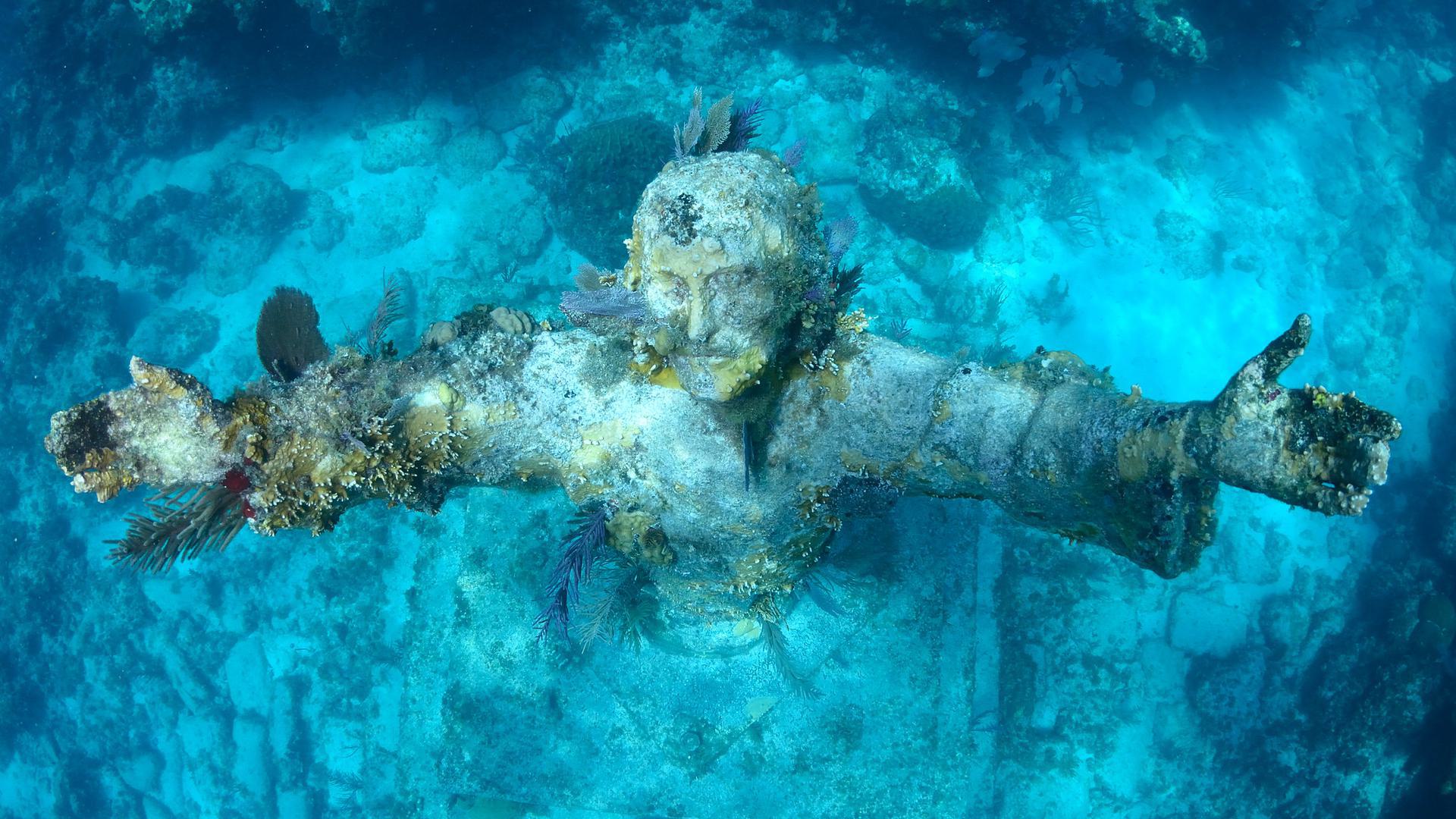 a statue of Christ unerwater
