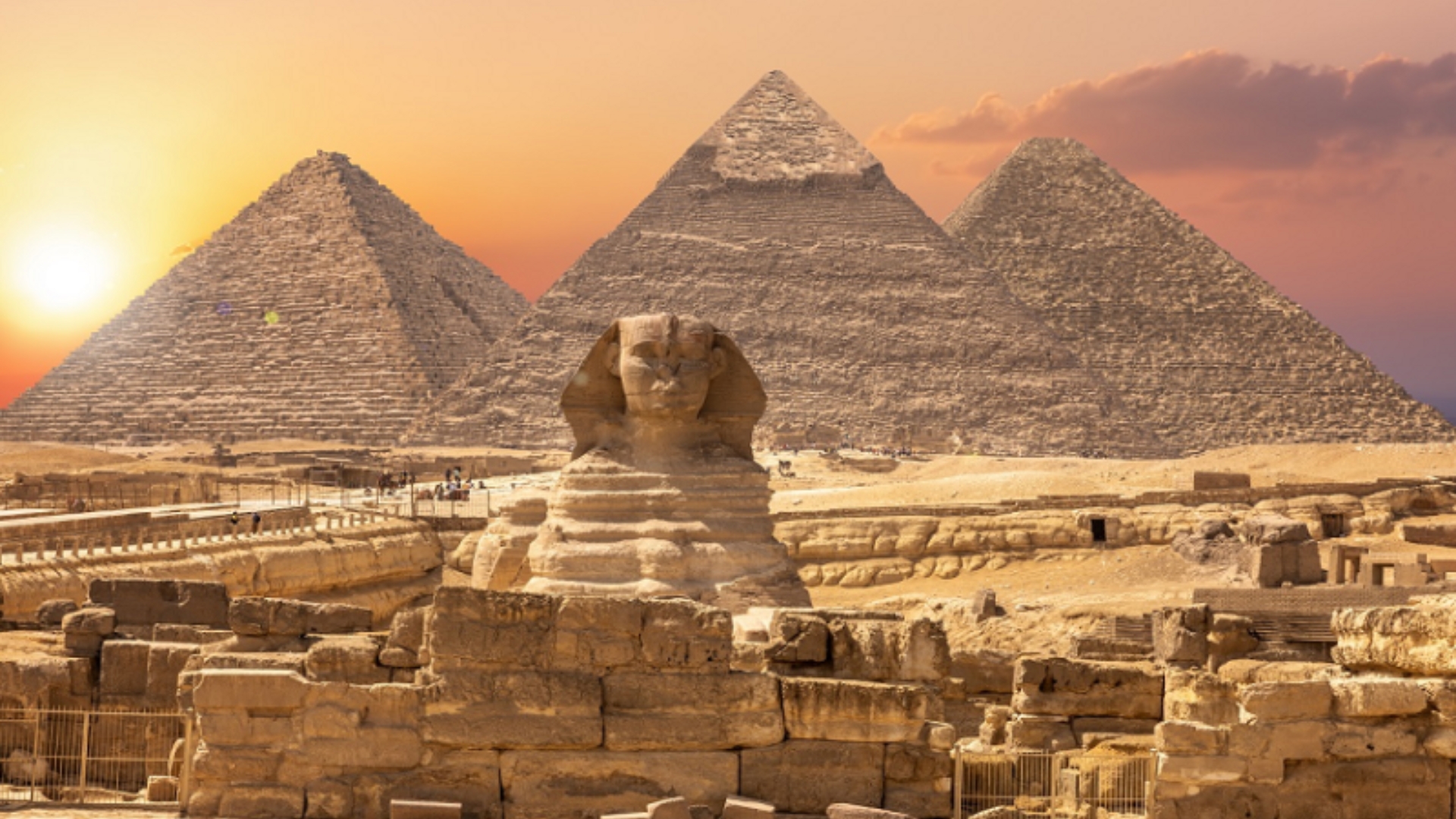 Photo of Sphinx and pyramids in Giza Plateau.