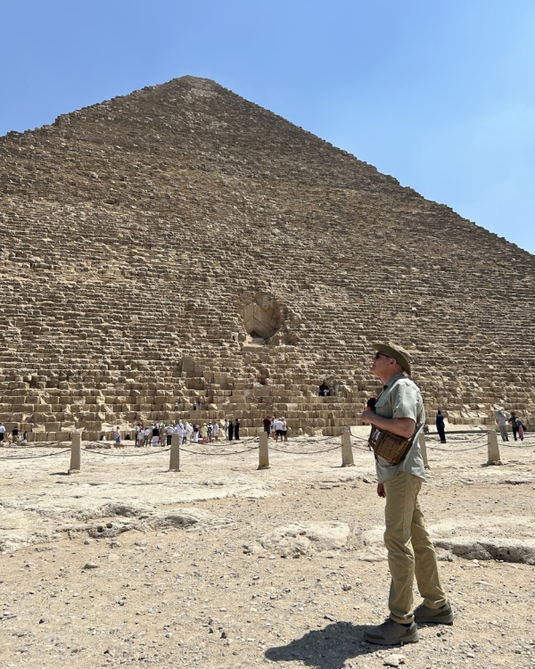 Photo of Scuba Jay in front of the Great Pyramid of Khufu.