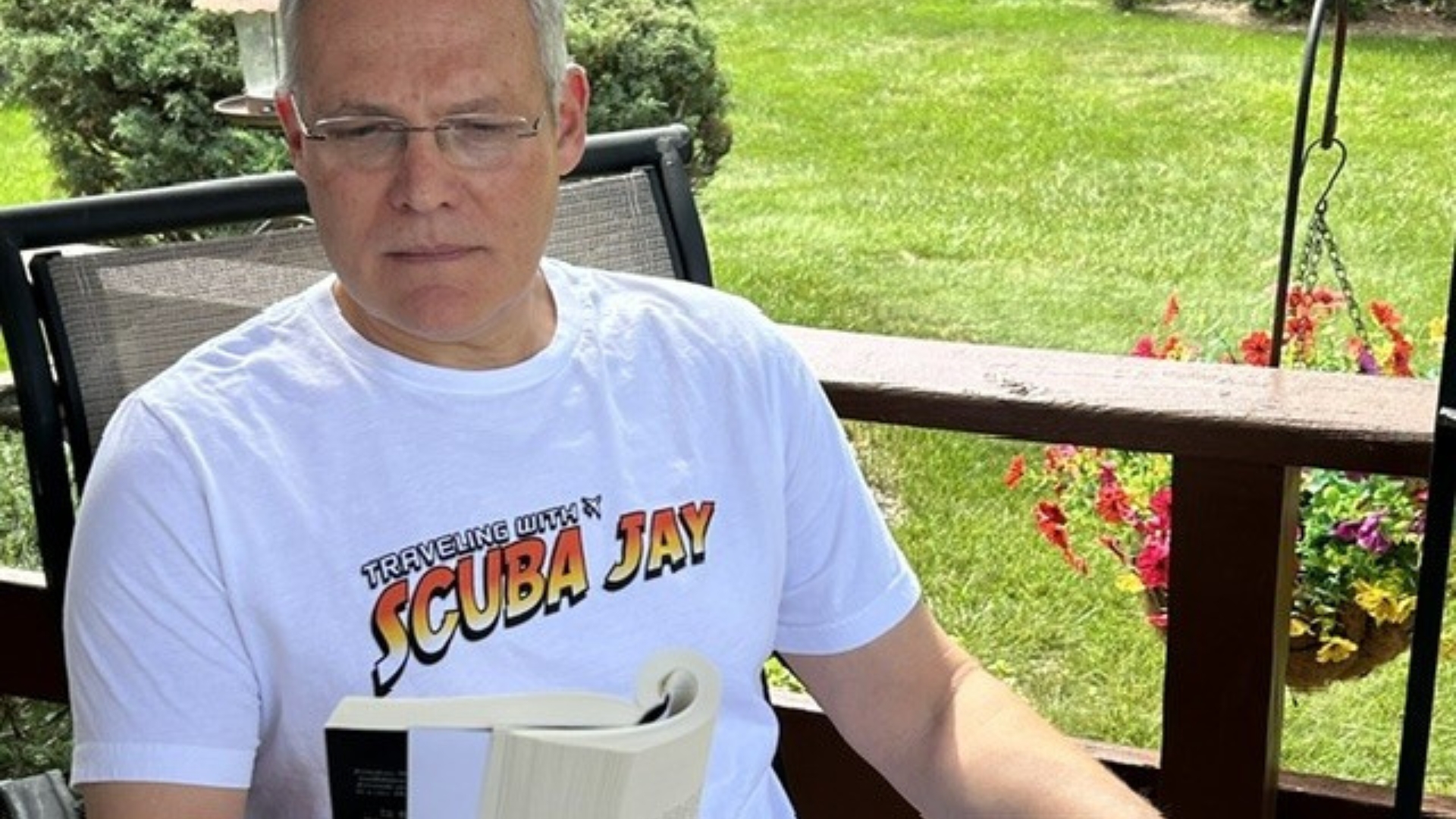 Photo of Scuba Jay reading a book.
