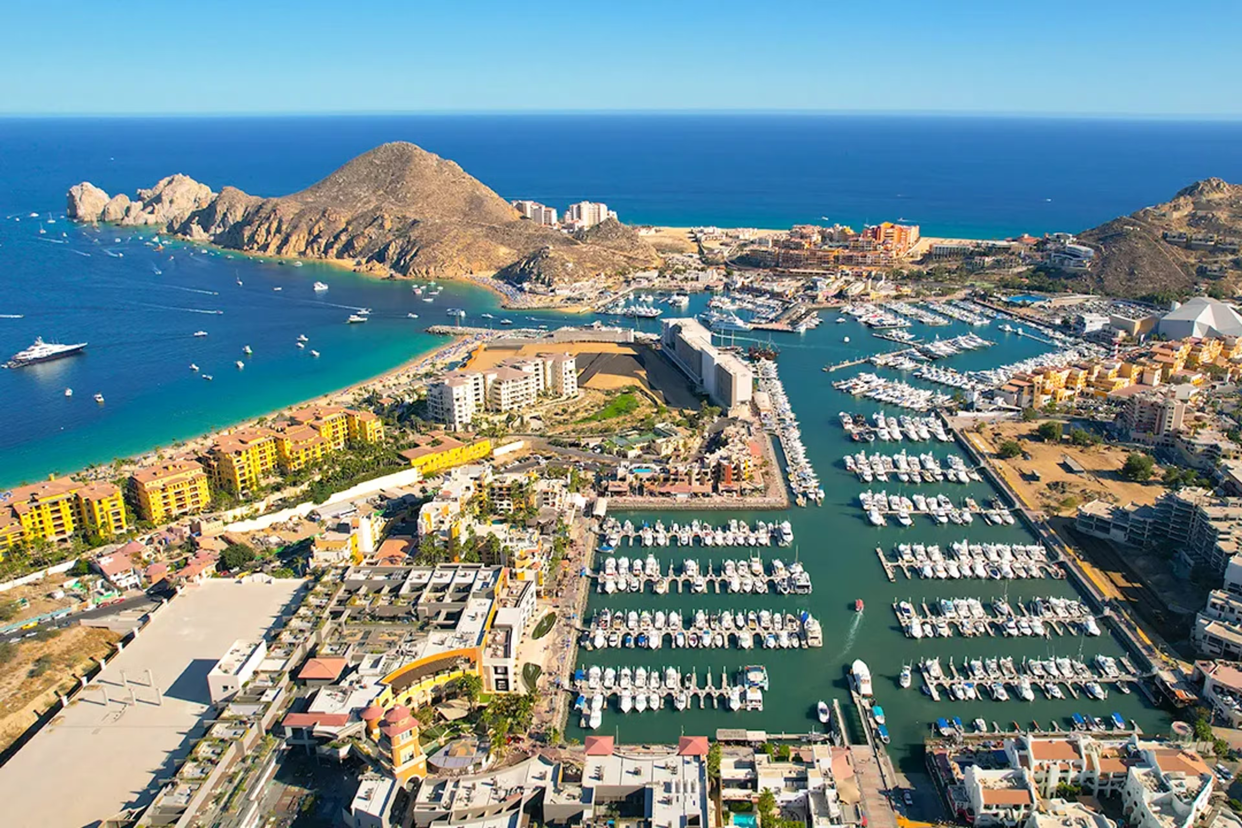 an aerial view of the tourist district of cabo san lucas