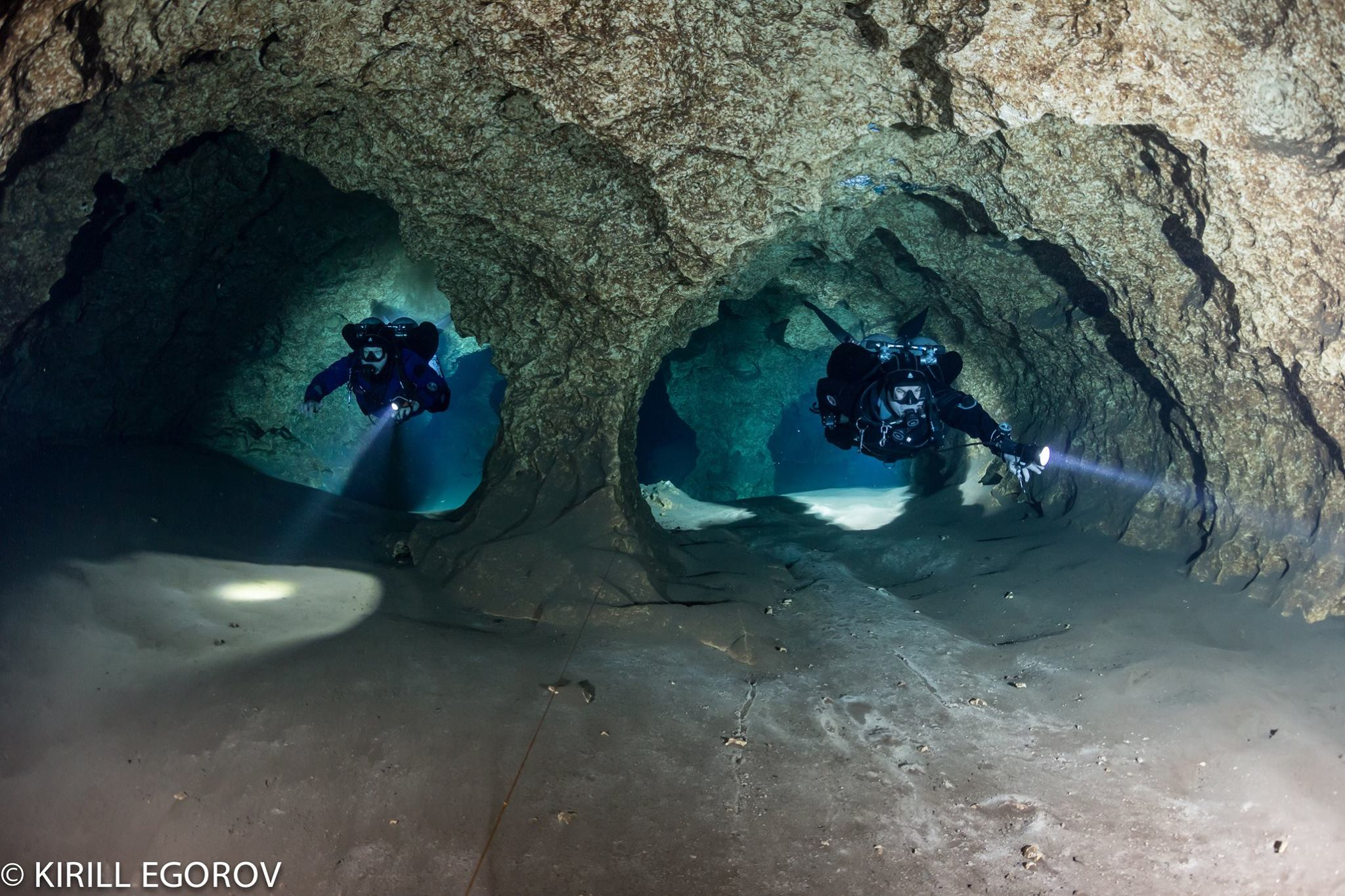 two divers in underwater caves