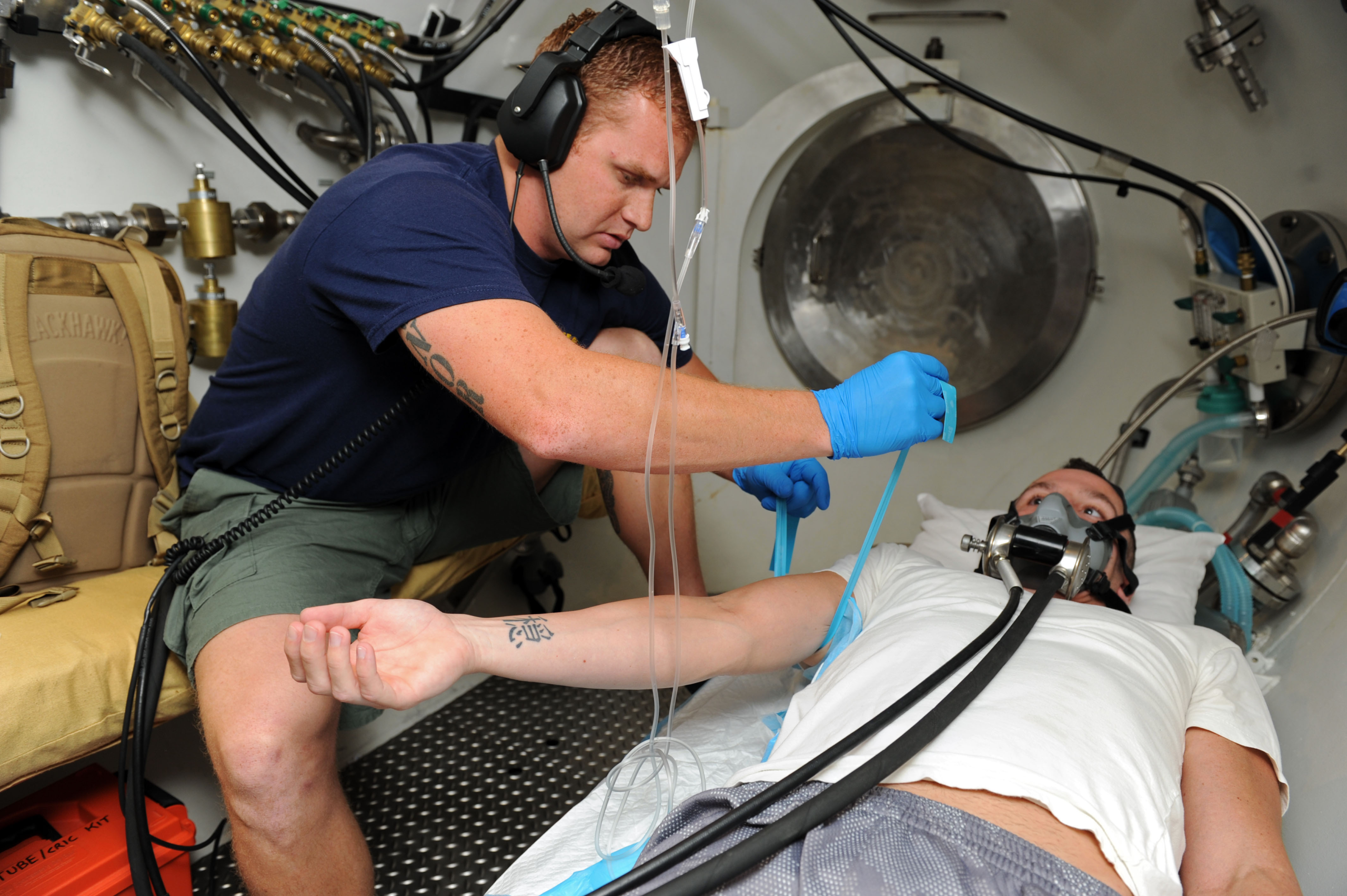 a person medically helping another laying down
